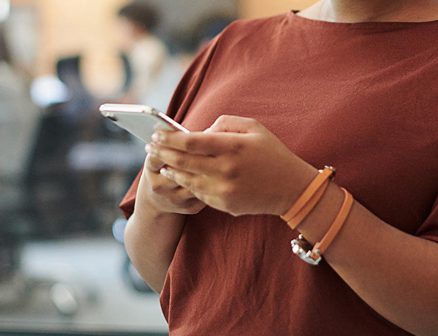 Woman texting on smart phone