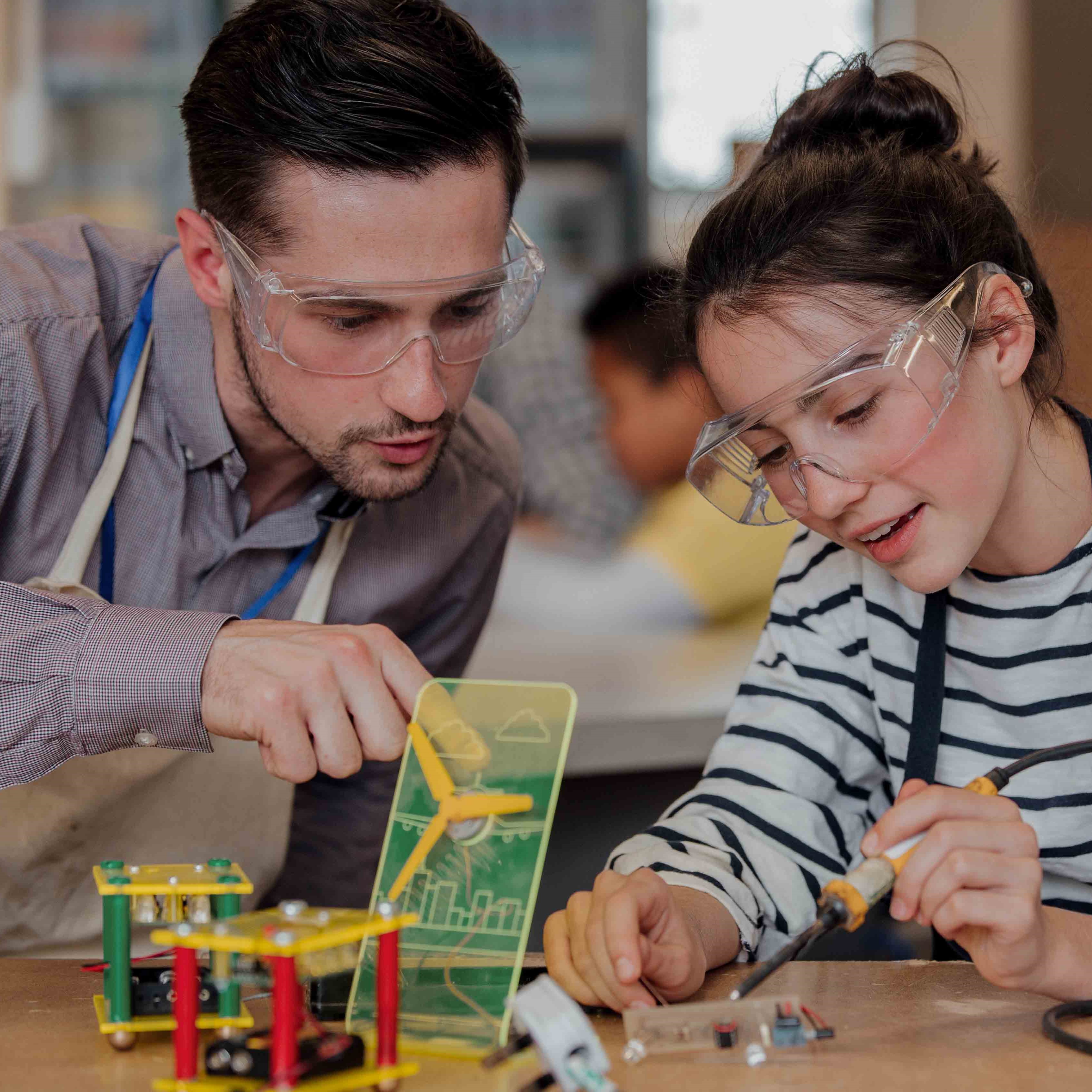 Two students explore a science project.