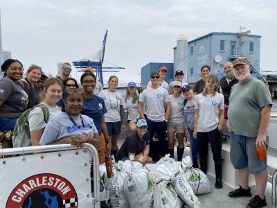 AmeriCorps volunteers with Sustainability Institute Environmental Conservation Corps on boat.