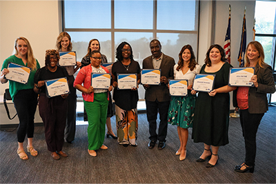 Graduates from the Fall 2024 Lead United class holding certificates