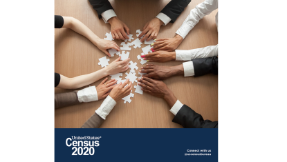 multiple hands in a circle holding puzzle pieces