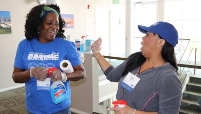 Monifa Ellington smiling with another one of her team members