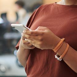 Woman texting on smart phone